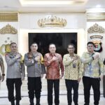 WUJUDKAN SINERGITAS DALAM PENEGAKAN HUKUM PERSAINGAN USAHA DI DAERAH, KETUA KPPU MELAKUKAN AUDIENSI BERSAMA POLDA LAMPUNG